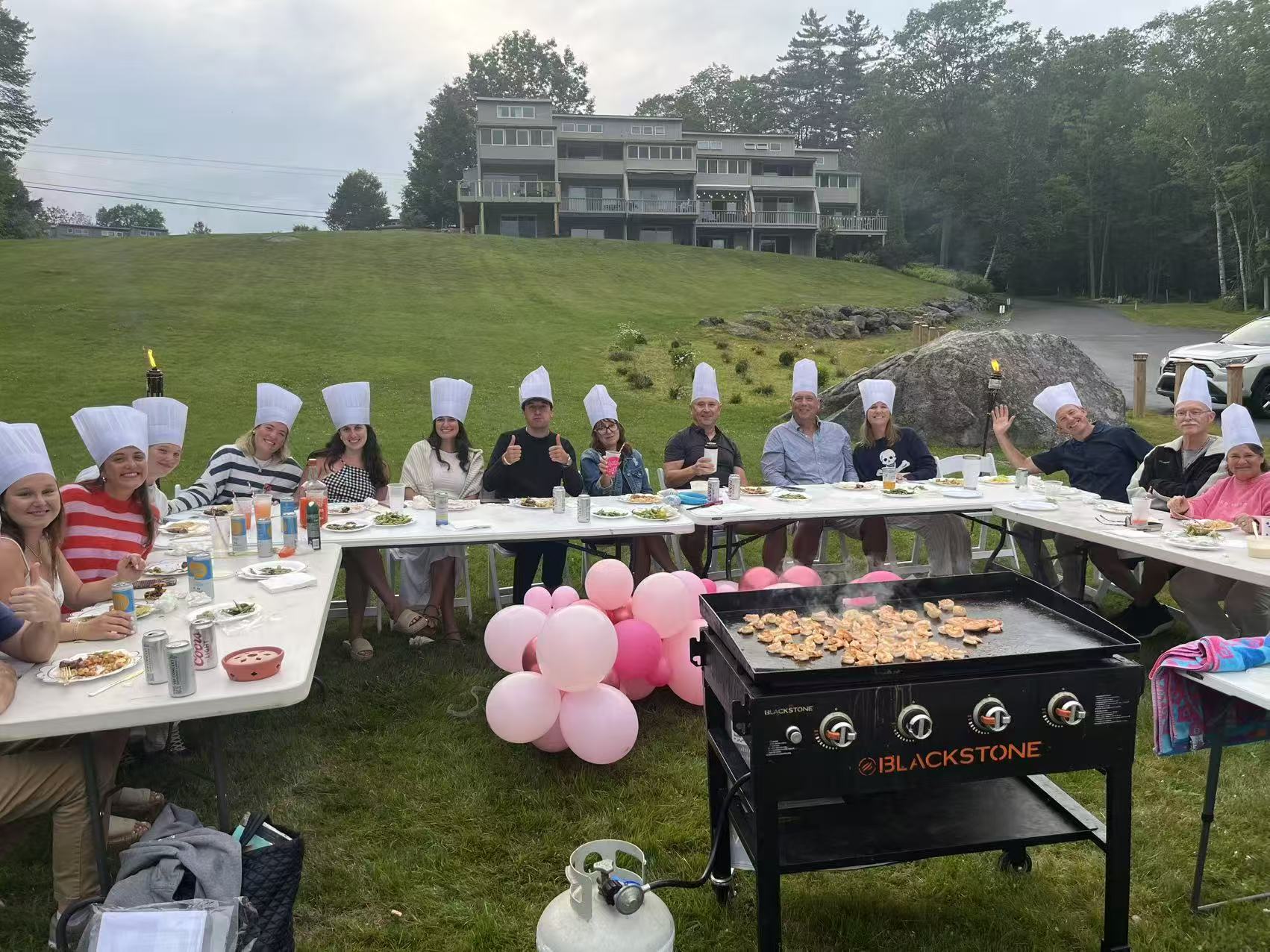 Go For Hibachi backyard party with guests around the hibachi table